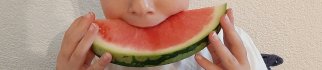 Child enjoying watermelon firmness. Photo by WUR