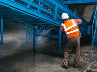 Employee cleaning infrastructure. Photo by franz12/Shutterstock.com