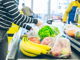 Bananas bought by a consumer. Photo by Vera Petrunina/Shutterstock.com